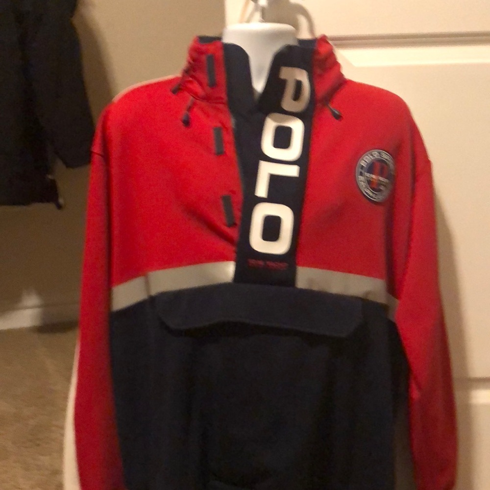 Polo jacket, hooded with reflective stripe.